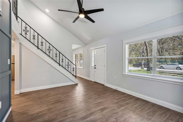 entrance foyer featuring stairway, a ceiling fan, wood finished floors, baseboards, and lofted ceiling