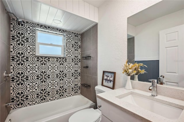 bathroom featuring shower / bathing tub combination, toilet, and vanity