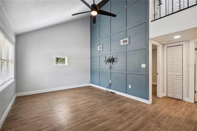 interior space featuring a wealth of natural light, ceiling fan, and wood finished floors