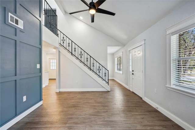 entrance foyer with dark wood finished floors, a healthy amount of sunlight, and a ceiling fan