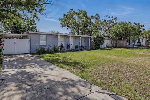 1211 E Camellia Dr, Brandon, FL 33510 - view of front of house with a gate, driveway, and concrete block siding