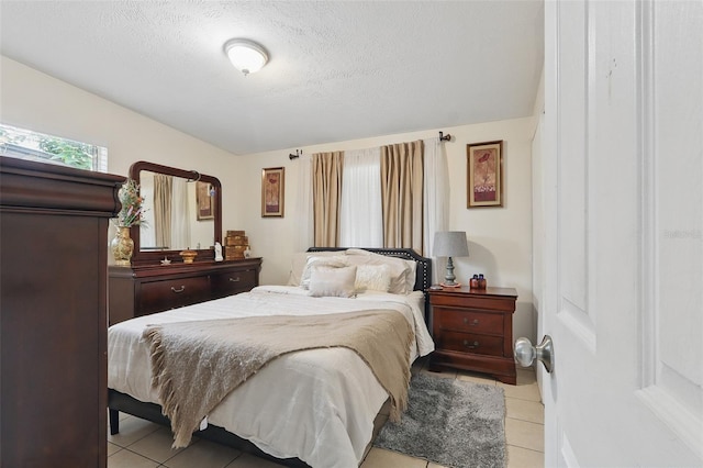 1211 E Camellia Dr, Brandon, FL 33510 - bedroom featuring light tile patterned floors and a textured ceiling