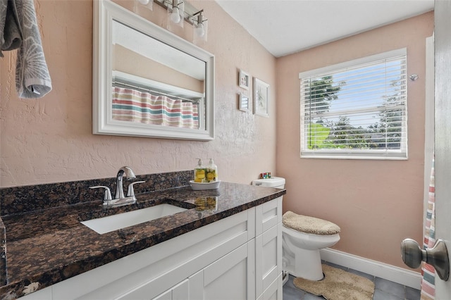 1211 E Camellia Dr, Brandon, FL 33510 - bathroom featuring toilet, vanity, tile patterned flooring, and baseboards