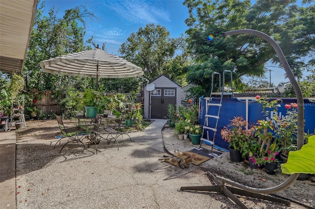 1211 E Camellia Dr, Brandon, FL 33510 - view of patio with a shed, an outbuilding, fence, and outdoor dining area