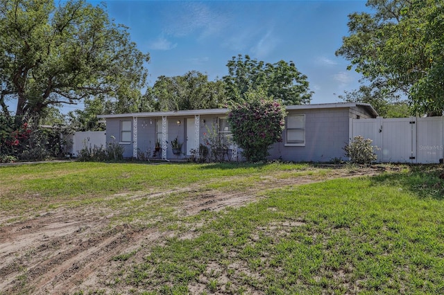 1211 E Camellia Dr, Brandon, FL 33510 - back of house featuring concrete block siding and a gate
