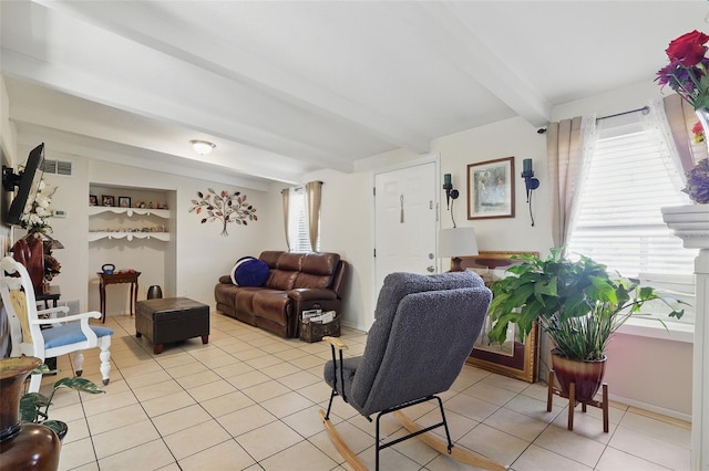 1211 E Camellia Dr, Brandon, FL 33510 - living area with beam ceiling and light tile patterned floors