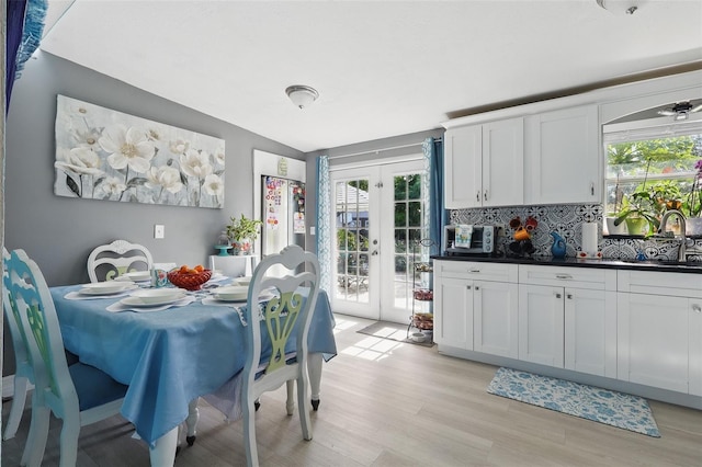 1211 E Camellia Dr, Brandon, FL 33510 - dining space featuring french doors and light wood-style floors