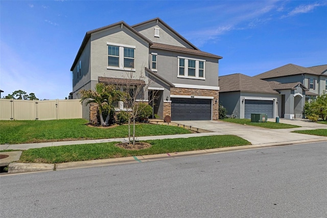 view of front of property featuring fence, concrete driveway, a front yard, stucco siding, and a gate