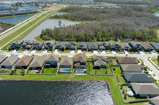 birds eye view of property featuring a residential view and a water view