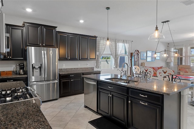 kitchen featuring a sink, stainless steel appliances, plenty of natural light, and visible vents