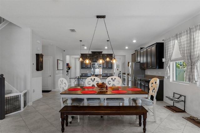 dining room with light tile patterned floors, visible vents, and recessed lighting