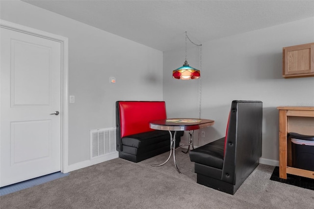 dining room with carpet flooring, baseboards, and visible vents