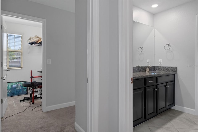 bathroom featuring vanity and baseboards