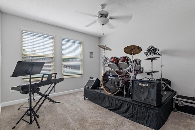 bedroom with carpet flooring, a textured ceiling, and baseboards