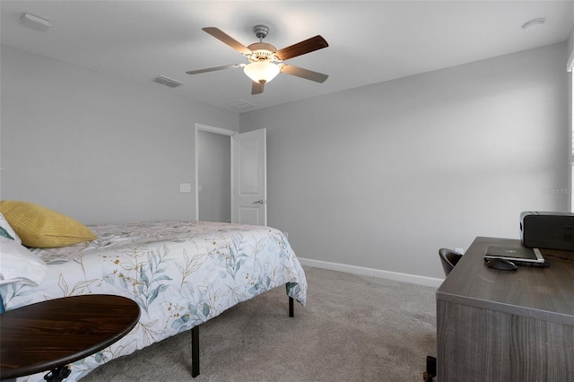 carpeted bedroom with a ceiling fan, baseboards, and visible vents