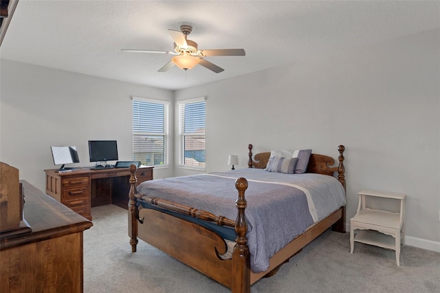 bedroom with baseboards, light carpet, and ceiling fan