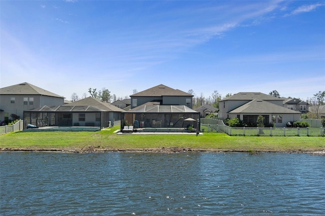 view of water feature with a fenced backyard and a residential view