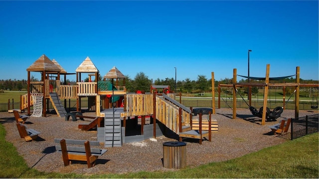 8780 Flourish Dr, Land O Lakes, FL 34637 - communal playground featuring fence