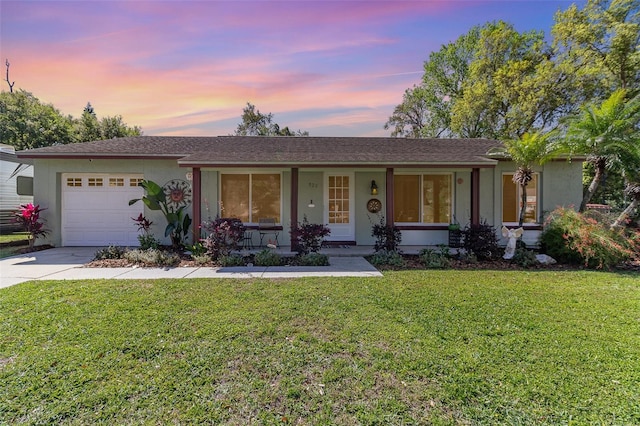 820 Rio Ala Mano Dr, Altamonte Springs, FL 32714 - ranch-style home featuring a porch, stucco siding, an attached garage, and driveway