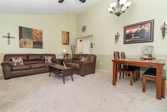 carpeted living area featuring a chandelier, high vaulted ceiling, and baseboards