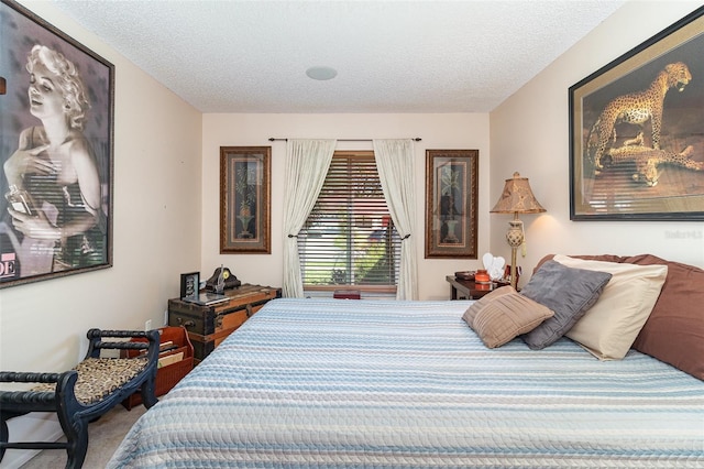 carpeted bedroom featuring a textured ceiling