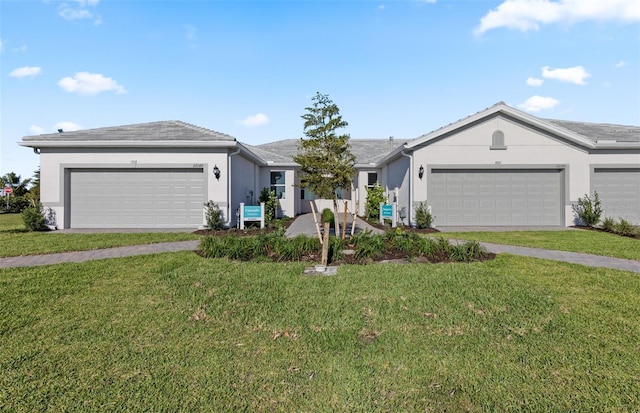 ranch-style house with a front lawn, a garage, and stucco siding