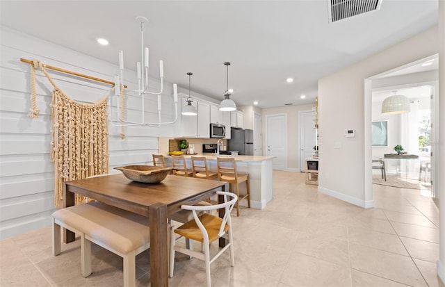 dining room featuring light tile patterned floors, recessed lighting, visible vents, and baseboards