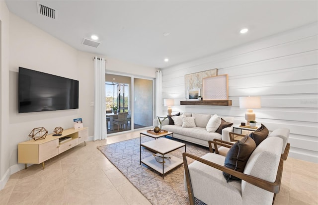 living area featuring visible vents, recessed lighting, and baseboards