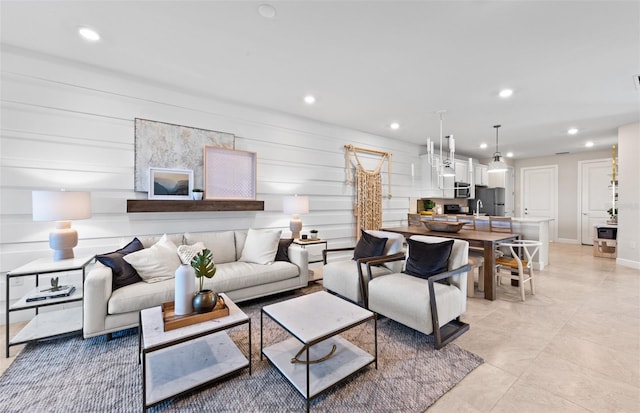 living area with recessed lighting and baseboards