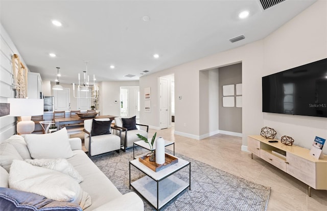 living room with light tile patterned floors, visible vents, recessed lighting, and baseboards