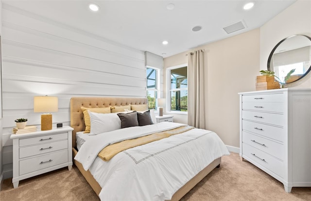 bedroom featuring visible vents, recessed lighting, baseboards, light colored carpet, and attic access