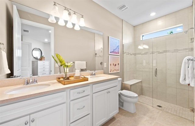 full bathroom with a sink, a stall shower, double vanity, and tile patterned flooring