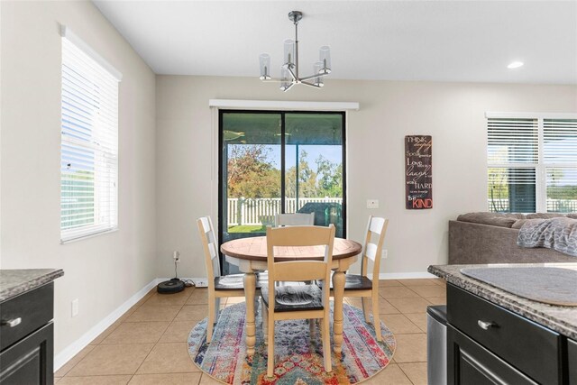 dining room featuring an inviting chandelier, light tile patterned floors, recessed lighting, and baseboards