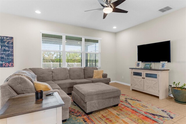 living room featuring light tile patterned floors, baseboards, visible vents, recessed lighting, and ceiling fan