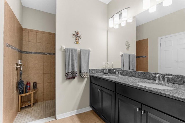 bathroom with tile patterned flooring, a walk in shower, and a sink