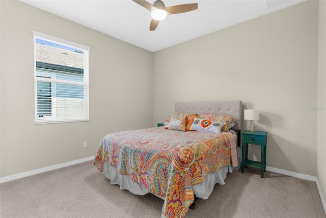 bedroom featuring carpet flooring, a ceiling fan, and baseboards