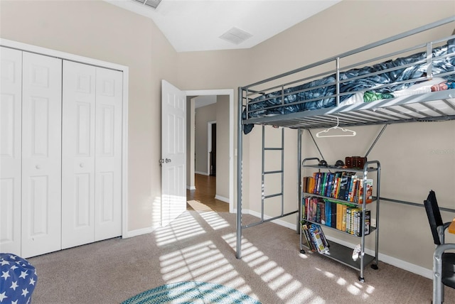 bedroom with a closet, visible vents, baseboards, and carpet