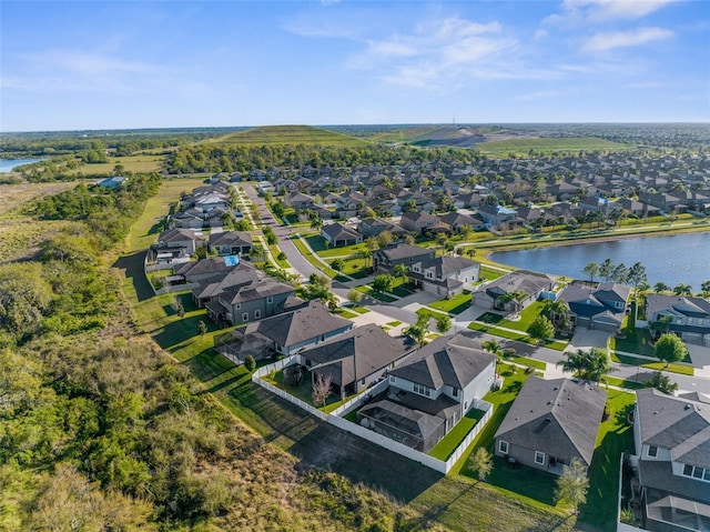 birds eye view of property featuring a residential view and a water view