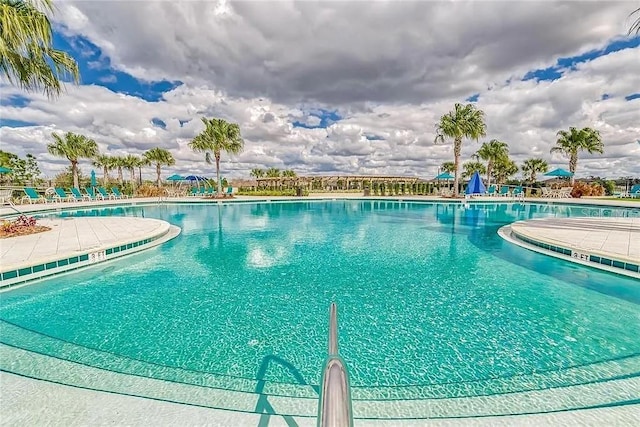 community pool with a patio area