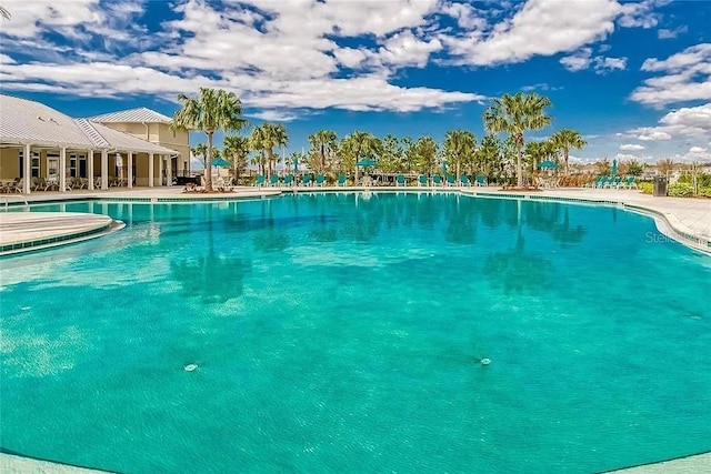 community pool with a patio area