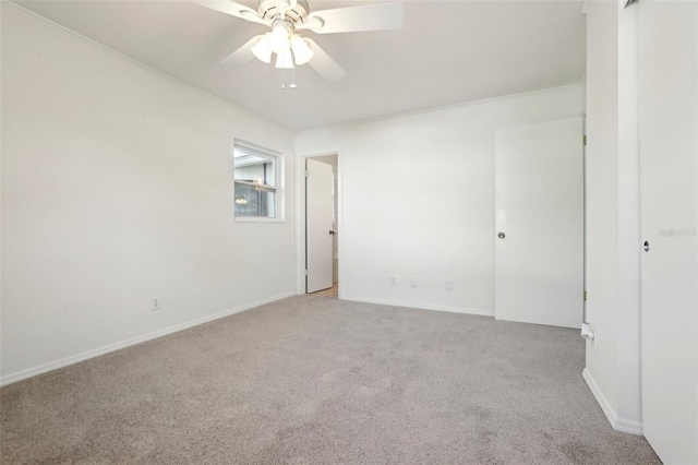 unfurnished room featuring ceiling fan, baseboards, and carpet