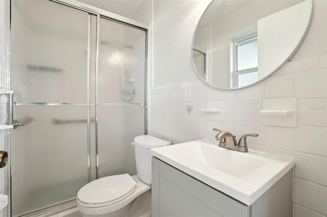 full bath with a baseboard heating unit, a stall shower, toilet, and vanity