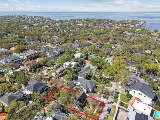 birds eye view of property with a water view and a residential view