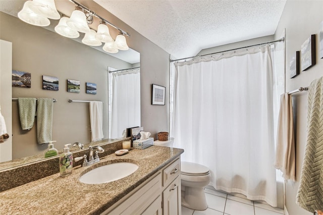 bathroom featuring vanity, shower / bath combo with shower curtain, a textured ceiling, tile patterned floors, and toilet