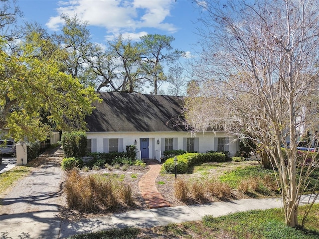 cape cod-style house with fence