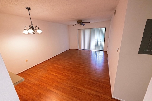6125 113th St Unit 505, Seminole, FL 33772 - empty room with light wood-type flooring, a chandelier, a ceiling fan, and a textured ceiling