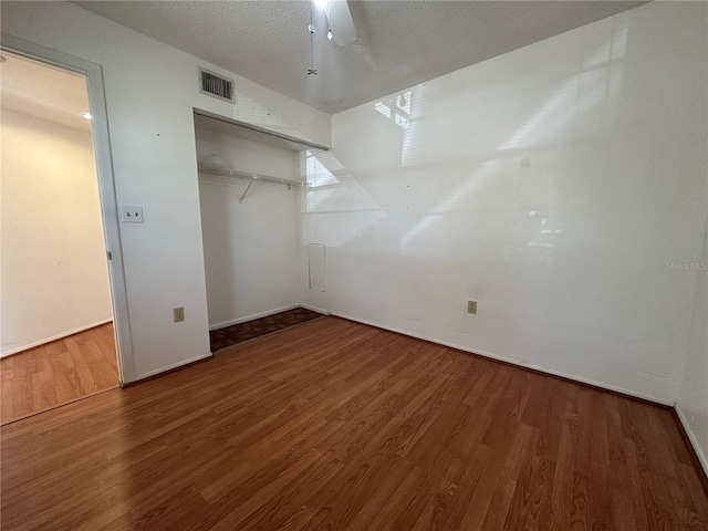 6125 113th St Unit 505, Seminole, FL 33772 - unfurnished bedroom with wood finished floors, a closet, and ceiling fan