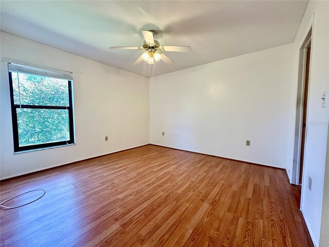 6125 113th St Unit 505, Seminole, FL 33772 - spare room featuring wood finished floors and ceiling fan