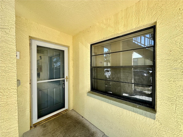 6125 113th St Unit 505, Seminole, FL 33772 - doorway to property featuring stucco siding