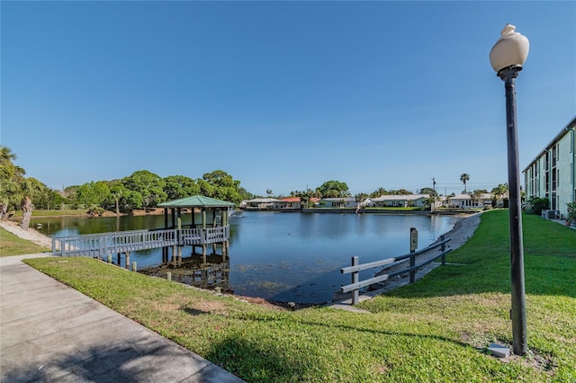 6125 113th St Unit 505, Seminole, FL 33772 - dock area with a gazebo, a lawn, and a water view